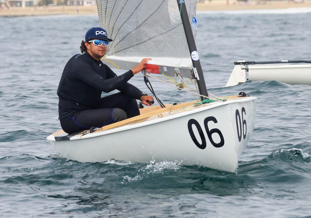Finn sailor racing upwind, close-up